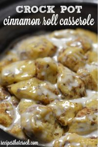 Crock Pot Cinnamon Roll Casserole is written in white letters above a corresponding image. 