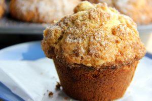 A freshly baked muffin on parchment paper