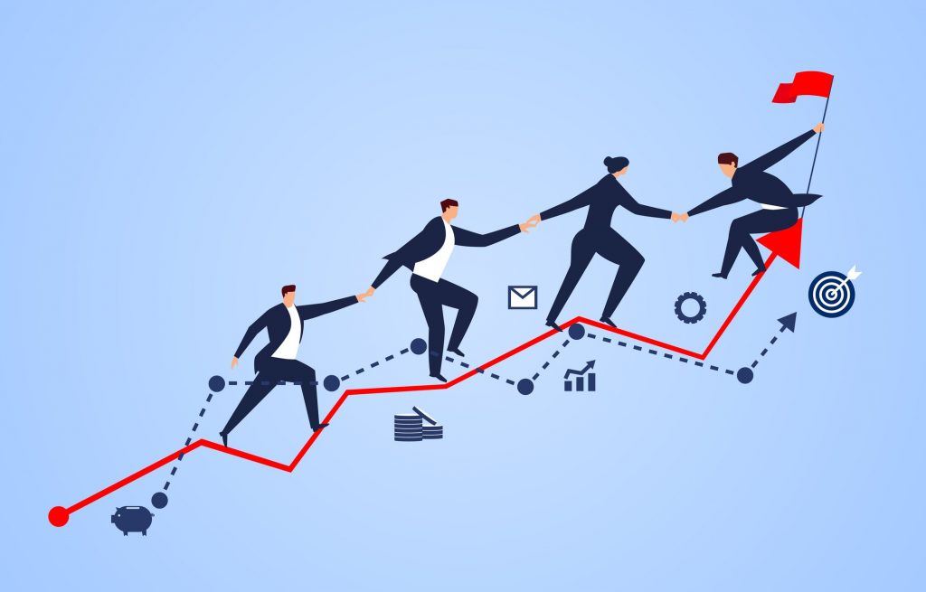 A group of businessmen holding hands on a business chart
