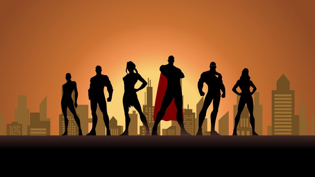 A silhouette style vector illustration of a team of superheroes with city skyline in the background. Wide screen format, wide space available for your copy.