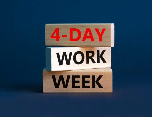 4-day work week symbol. Concept words '4-day work week' on wooden blocks. Beautiful grey background. Copy space. Business and 4-day work week concept.