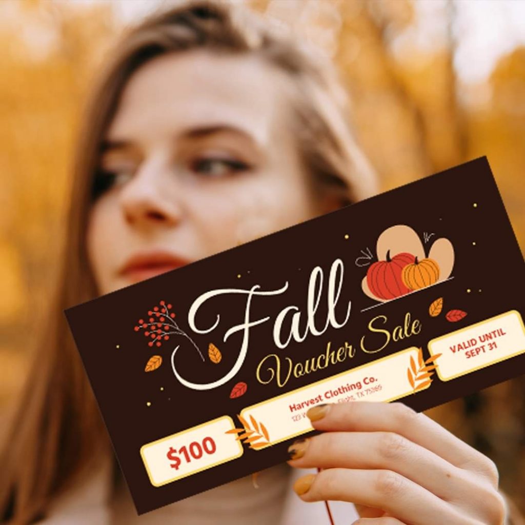 Attractive, young Caucasian woman holding up a fall advertisement from 123Print.