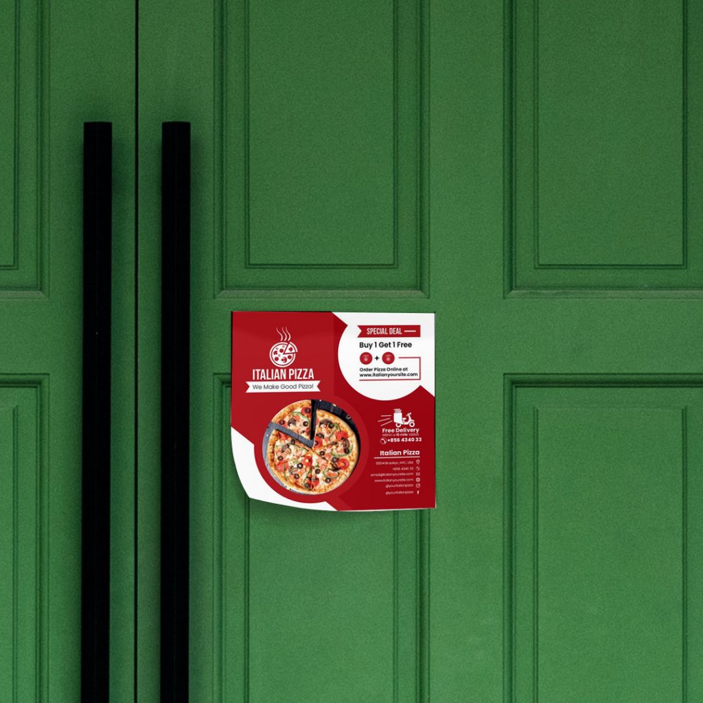 A red and white flyer on a green door offering a free pizza.